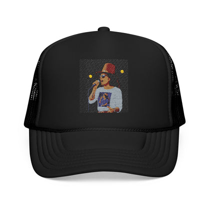 Black trucker cap with a graphic of a person wearing a hat and sunglasses on a white background
