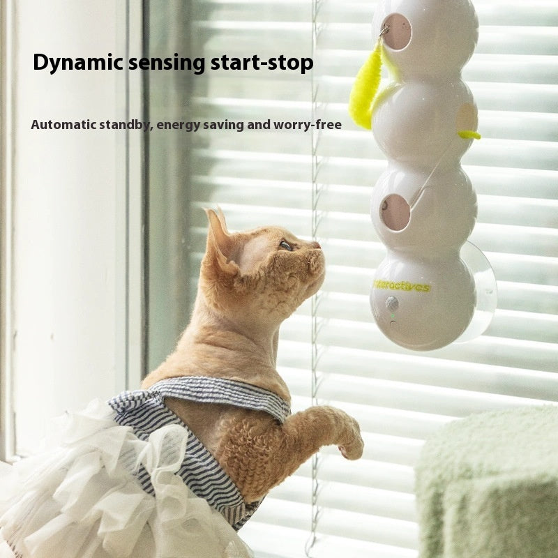 Close-up of rotating smart cat toy with colorful arms engaging the cat