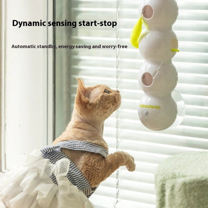 Close-up of rotating smart cat toy with colorful arms engaging the cat