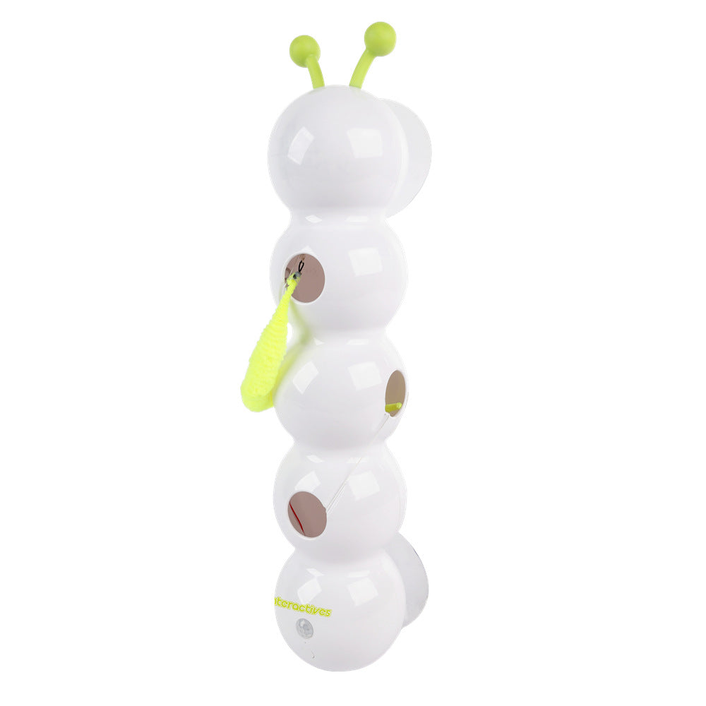 Toy caterpillar with white body, brown spots, and green antennas on a white background