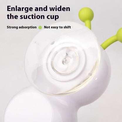 Close-up of a white suction cup with green arm on a light gray background